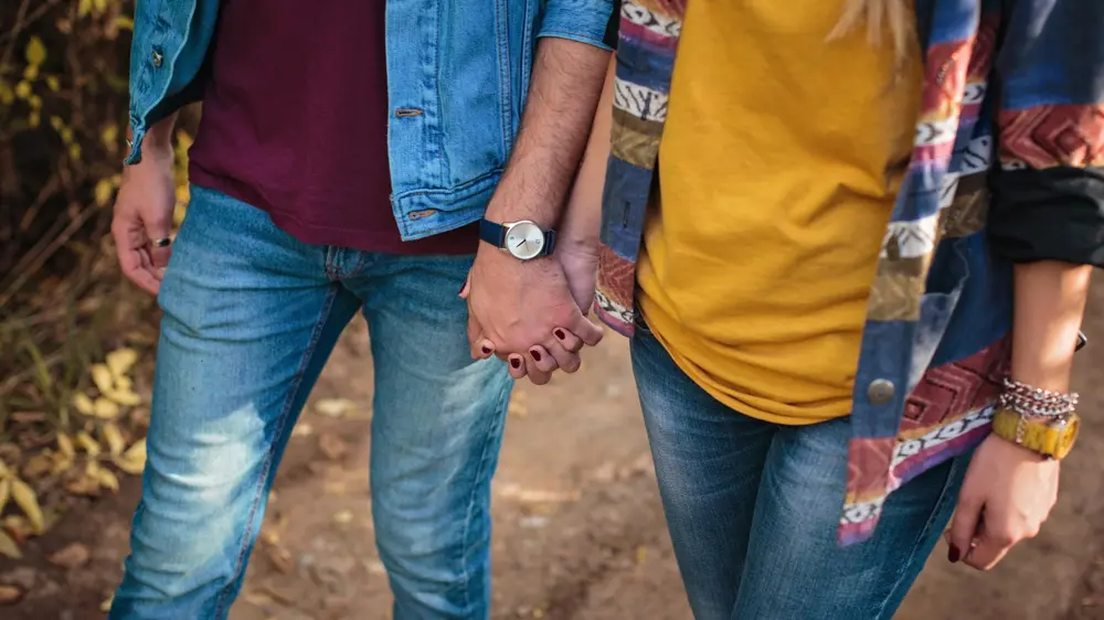 Couple holding hands