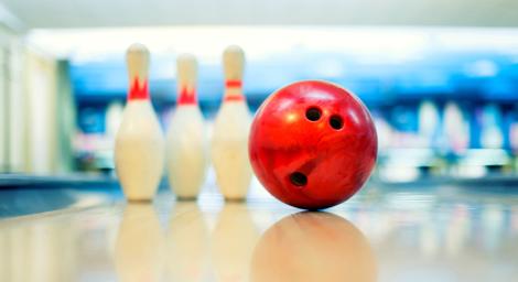 image of a bowling ball and skittles