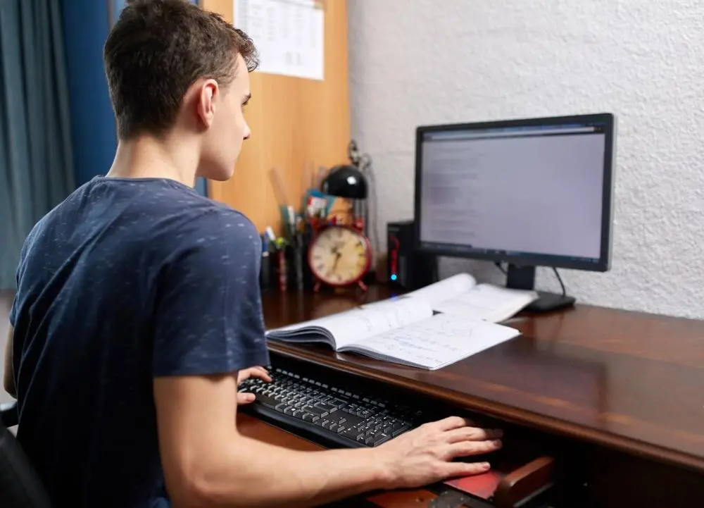 teenager on computer