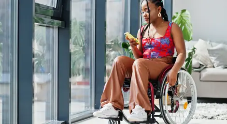 Woman in wheelchair inside house