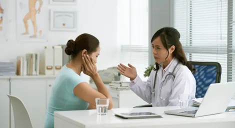 woman seeing her doctor